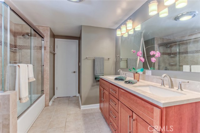 Remodeled 2nd bathroom with double sinks, granite countertops and glass enclosure