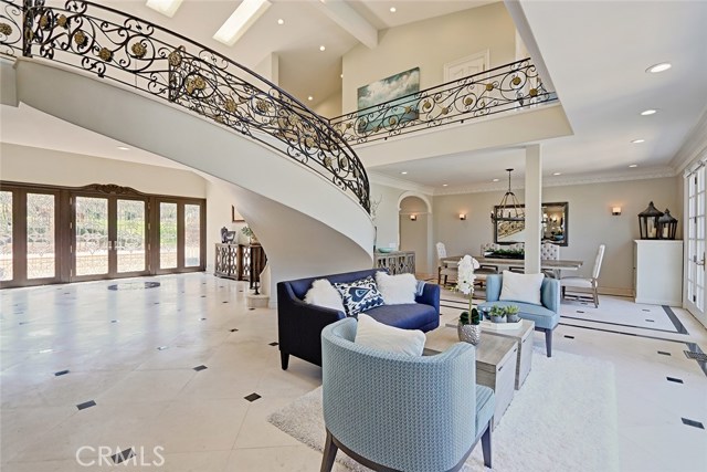 Tall ceilings and skylights lift the Foyer, creating an open and airy lightness to the space.