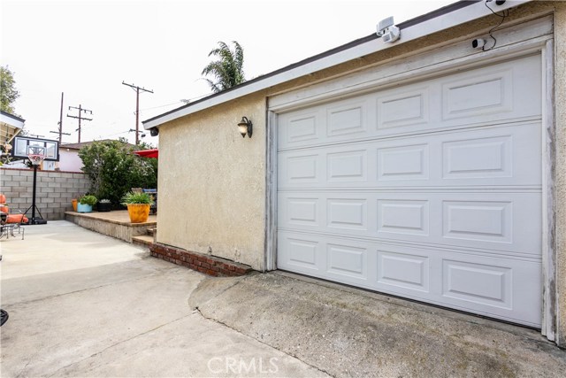 Two car, detached garage with roll-up door and extra storage cabinets inside. With plenty of street and driveway parking, the garage could also be used for a media or play room.