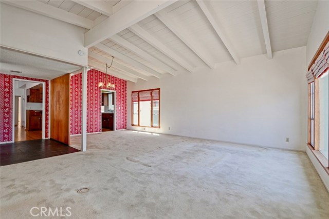 This shows the living room into the dining and kitchen on the west side of the home, the other entry is off the front door on the east side of the home.