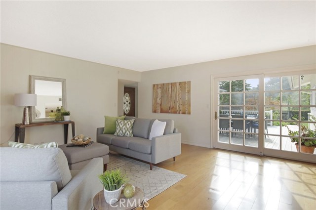 LIVING ROOM WITH LOTS OF NATURAL LIGHT