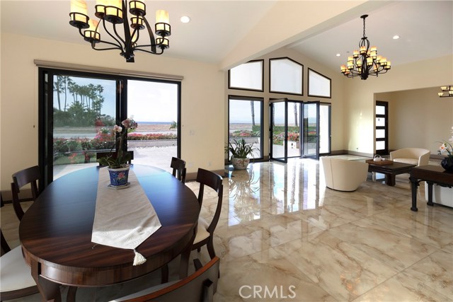 Dining Room going into Living Room - both with ocean views.