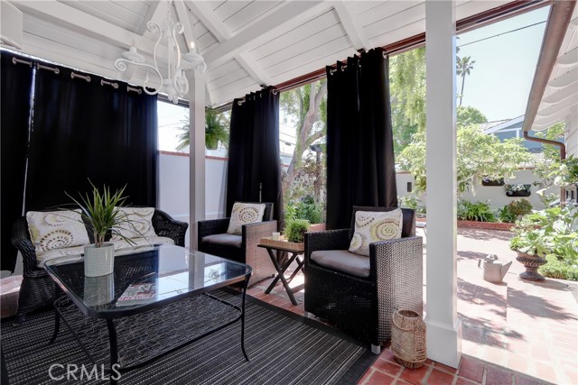 Indoor outdoor living in this softly enclosed den area just off the great room.