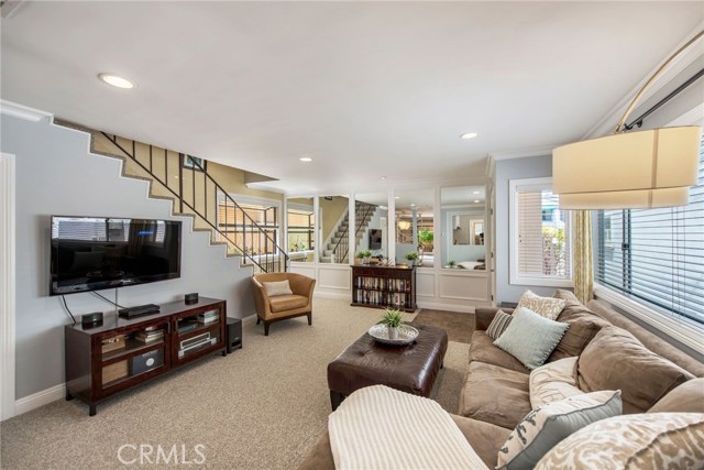 Living room with a large walk-in storage area to the left under the stairs