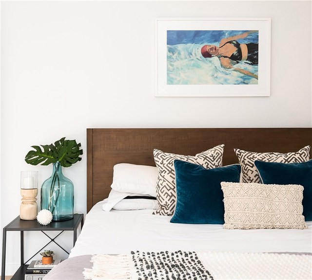 LARGE ENSUITE MASTER BEDROOM IS THE PERFECT RETREAT COMPLETE WITH UPDATED WALK-IN CLOSET, BALCONY AND SITTING AREA.