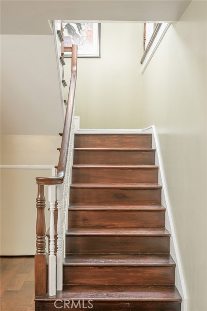 Beautiful Wood Bannisters and Deep Baseboards on Wood Staircase