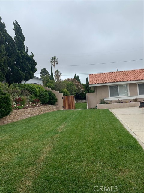 Side yard entrance on the east side.