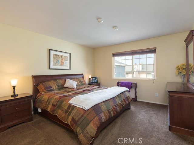 Master bedroom is comfortably large with plenty of room for king-sized bed, wide nightstands and large dresser.