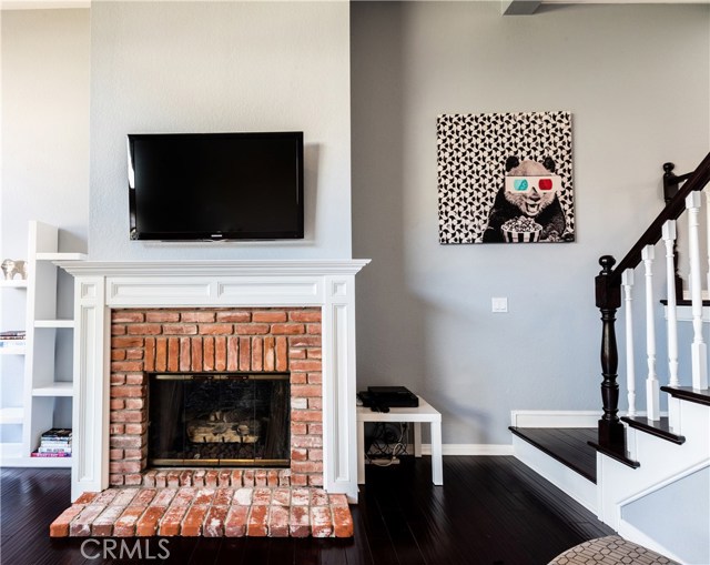 Charming and classic brick fireplace (and yes, the television is included)