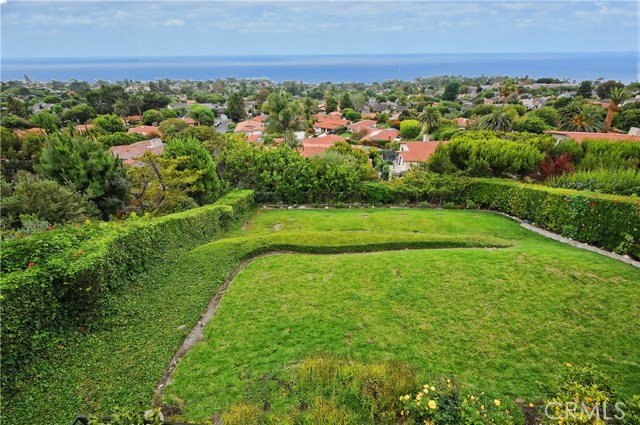 Expansive grassy rear yard that goes street to street.