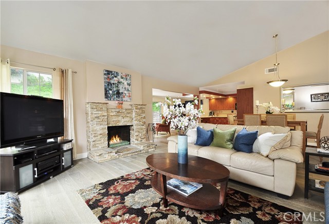 Great Room features a gorgeous new stacked stone Fireplace and new wide plank White Oak distressed Floors