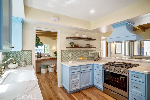Perfect for entertaining and for having large families for the holiday. Custom designer kitchen with top of the line appliances opens to the spacious living room and into the good size dining area. Perfect.