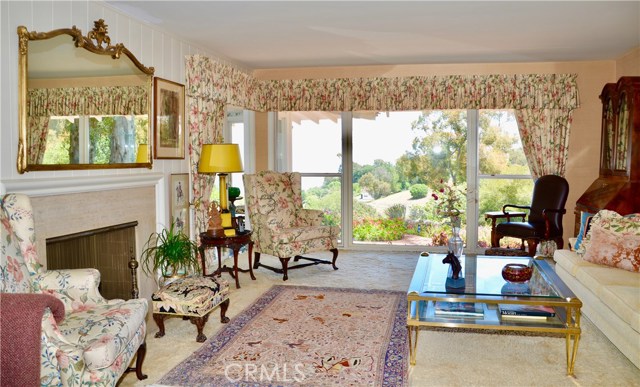 Living Room with fireplace is right off the front entry foyer.