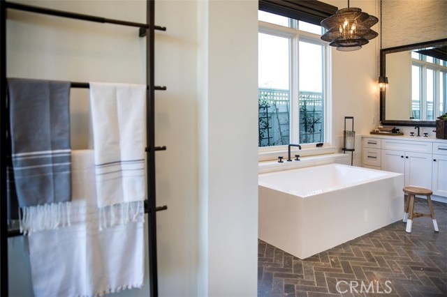 Sneak a peek into the luxurious master bathroom. Model home shown.