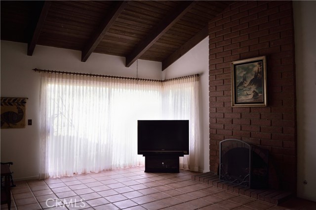 Family Room with Floor-to-ceiling Brick Fireplace