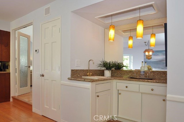 Wet Bar between Kitchen and Family Room next to Walk-in Pantry.