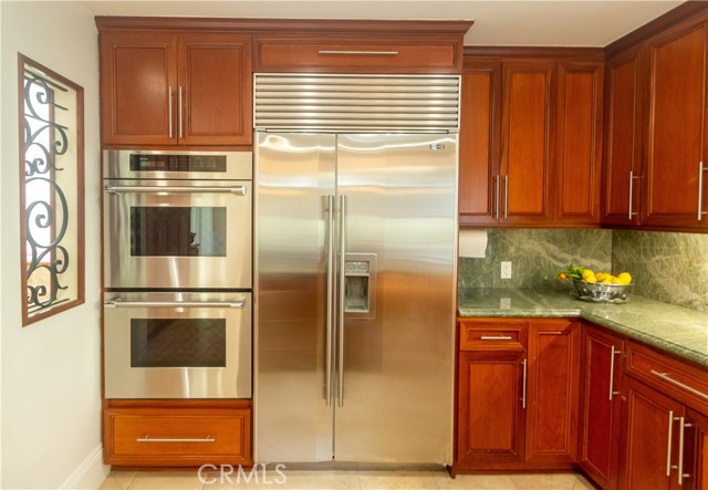 Double oven and Sub zero refrigerator along with beautiful granite counters.