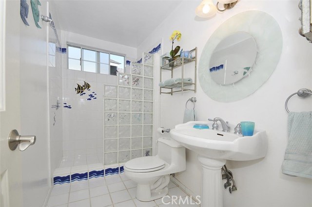 Upstairs bathroom with pedestal sink