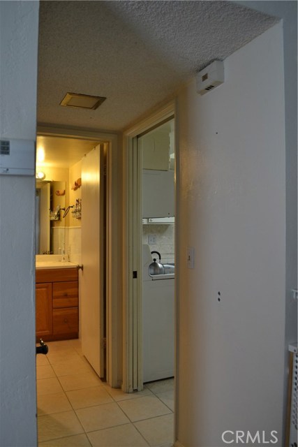 Here we see ground floor bath just off kitchen area(right) can be separated by pocket door.