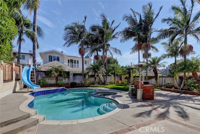 Backyard Patio and Pool Area with Adjacent Built-In BBQ