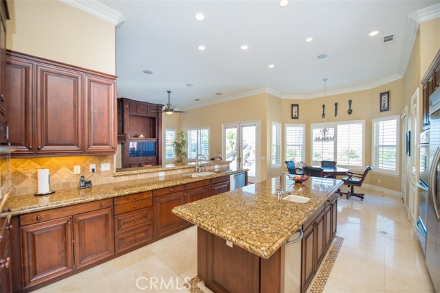 Gourmet Kitchen Featuring Granite Counters, Stainless Steel Appliances and Walk-In Pantry.