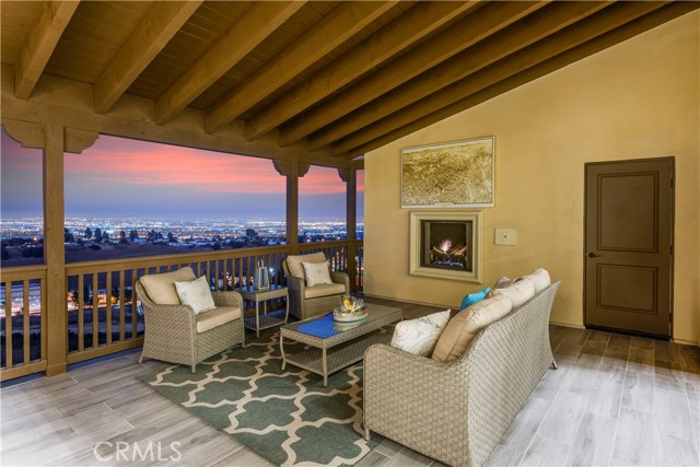 Memerizing views from the generous sized Patio off the living room with fireplace, wood tile flooring, and plug for outdoor TV. Doesn't get any better than this.