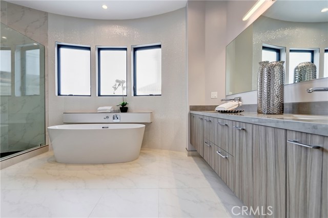 Top floor Master bath is oversized featuring stone and marble details