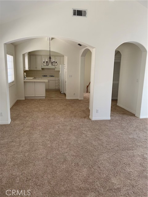 Open area from living room to dining and kitchen