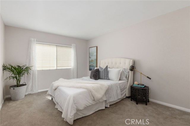 One of two primary bedrooms with attached bath.