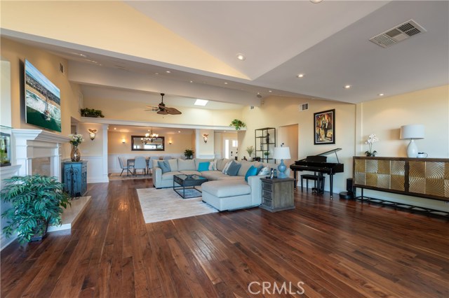 View of the living room with the large formal dining room in the background.