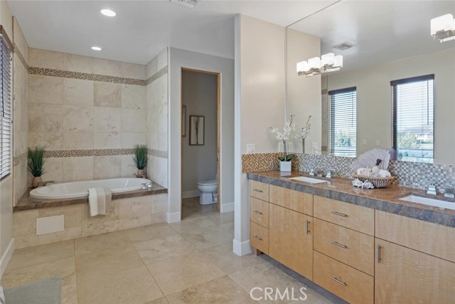 master bath with separate tub and shower