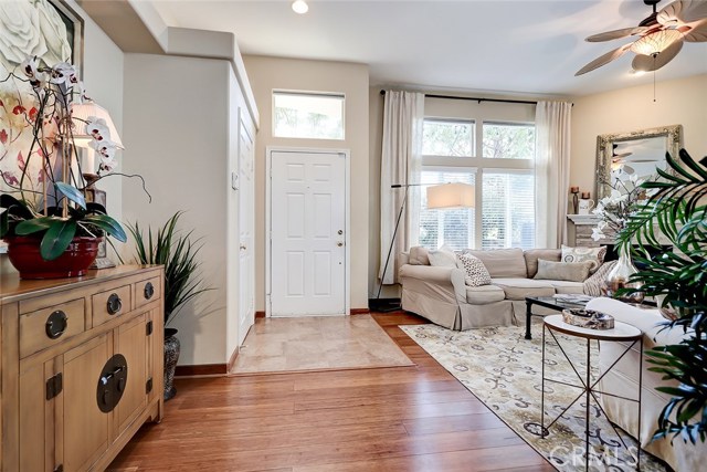 Front entry includes spacious coat closet, extra tall ceilings, and easy access to front yard patio.