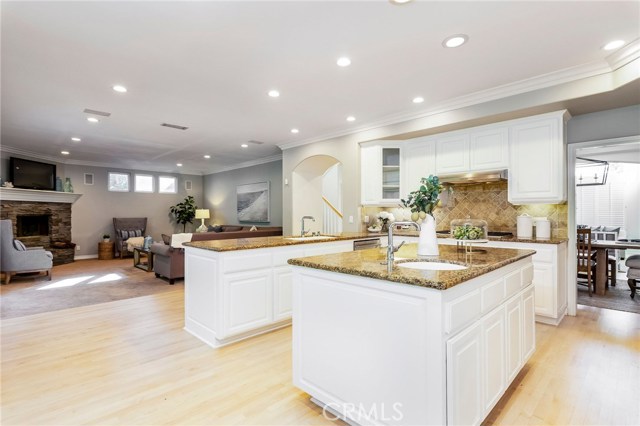 Open concept floor plan with kitchen leading to family room