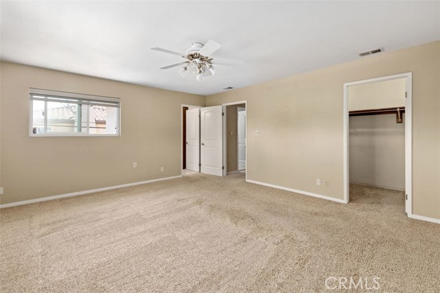 Enormous master bedroom with walk in closet & en-suite features large windows, plush carpeting making it a perfect spot to relax