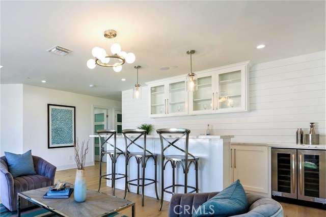 The Bar/Den/Game Room has Bar Counter Seating and a well sized area for a Den Furniture Suite.