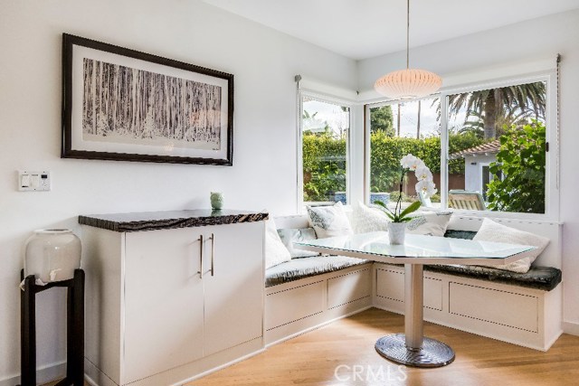 A home styled with a concept of something for everybody - the kitchen booth with views of the pool is a spot for all to enjoy.