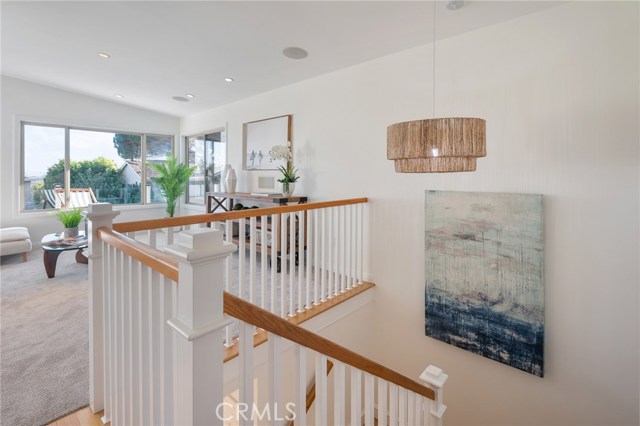Stairs leading to huge upstairs family room.