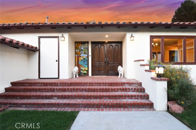 House is primarily a one level but there are a few steps at this main entry, fewer steps from the garage and a few between the 2 wings of the house