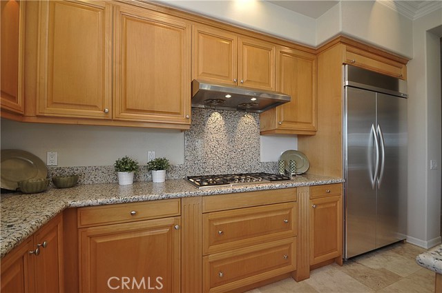 Kitchen with Cooking Range & Stainless Steel Refridgerator