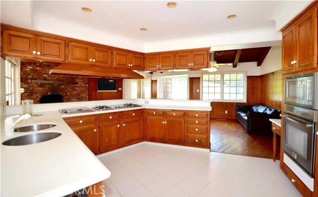 Kitchen is Open and Bright and features newer double ovens and an indoor griddle/grill.