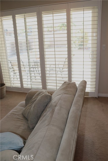 Patio off Living Room with Plantation Shutters and sliding doors