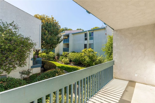 Balcony off of the living room has plenty of room for outdoor furniture so you can relax and enjoy the complex's courtyard view and lush landscaping