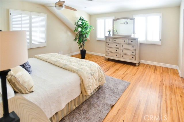 Large master bedroom....original pecan hardwood floors. (there's a story there). Here is the story . During WW2 all oak wood was used to create decks for aircraft carriers. Because of the unavailability of of oak for flooring for home construction the builders started using pecan hardwood . This home has such a marvelous history.