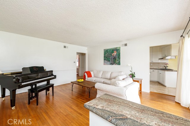 Wood floors throughout. (Note: big items in living room makes it appear smaller than it is.)