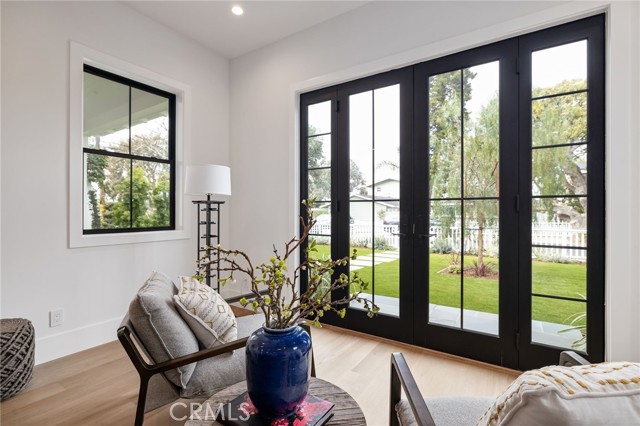 Sophisticated and timeless doors that expand morning coffee and cocktail hour into the front yard