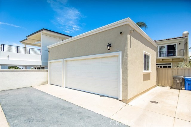 3 car garage plus adjacent parking space located on private alley