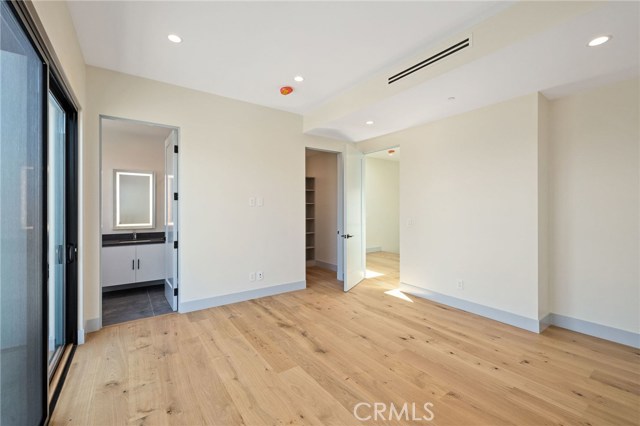 Spacious Bedroom With Walk-In Closet and Private Bath