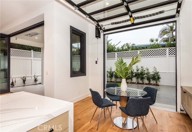 Designer grade rolling door maximizes the nook area with the outdoor patio.