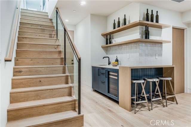 Lower level theater room with wet bar and wine refrigerator