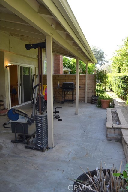 Backyard patio with view of sliders off kitchen area.